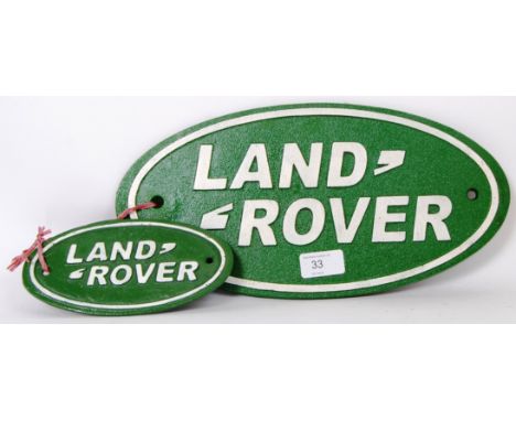 Two vintage style, 20th century wall plaques of the Land Rover logo. The plaques differ in size with the larger sign measurin