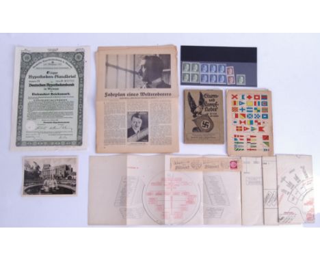 A collection of assorted original WWII and period German ephemera to include a German share certificate, rank chart, stamps, 
