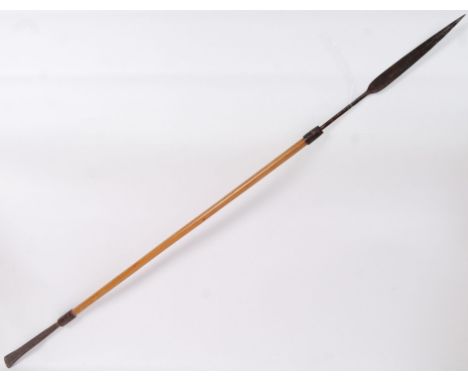 An original early 20th century Ashanti spear. Lightwood shaft, with spade end. Long blade. 134cm long in total. POSTAGE: Worl