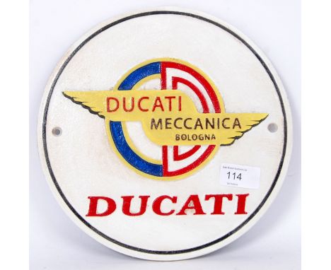 A vintage style, 20th century white wall plaque displaying the Ducati motorcycle logo. 25cm long.  POSTAGE: Worldwide postage
