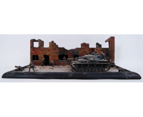 A good vintage Second World War WWII model diorama of a German tank and a ruined street scene. Some loose figures. 51cm long.