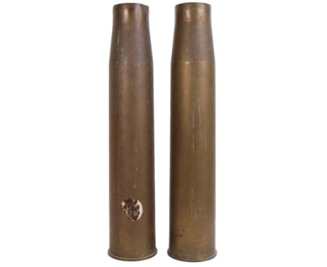 A pair of post-WWII Second World War artillery shells. C1954. Converted to umbrella stands / stick stands. Marks to base. App