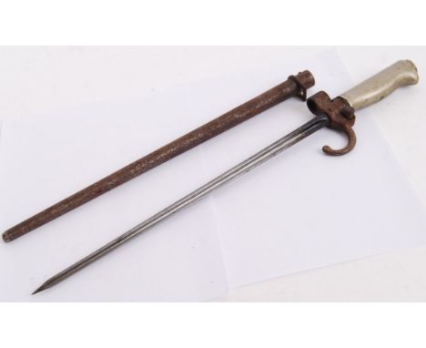 An antique likely French made cross fullered bladed rifle bayonet, with alloy handle. With scabbard. POSTAGE: Worldwide posta