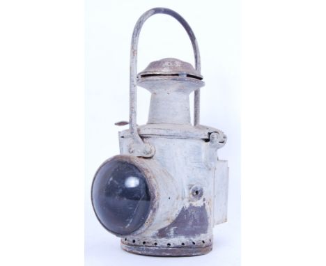 An original early to mid 20th century Railway lamp with domed glass light lens to front. Approx 37cm long.&nbsp;