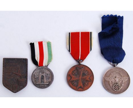 A collection of 4x German Third Reich medals / awards. Comprising of; Service In Africa medal, 8 Years Service medal etc. Alo