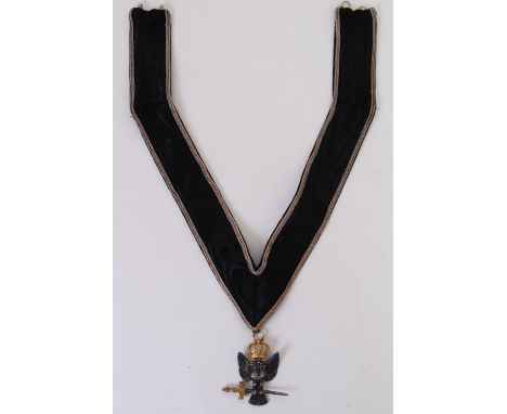 An original 20th century ceremonial Masonic fabric necklace with silver pendant. Pendant depicting an Eagle wearing a crown w
