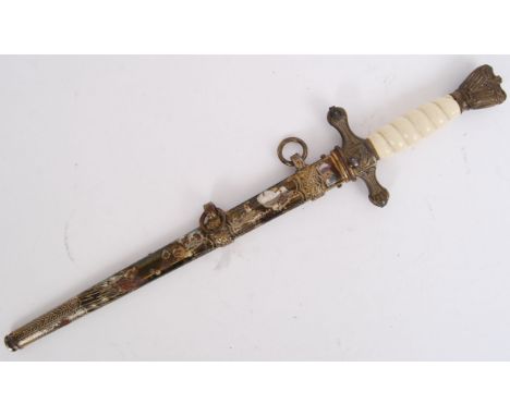 An original Imperial German naval dress dagger - with anchor to the cross hilt. AF eagle to top. With locking button blade an