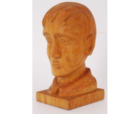 A World War One carving of solider killed at Ypres in 1918. Includes faded writing to the base saying 'Head of a young solide