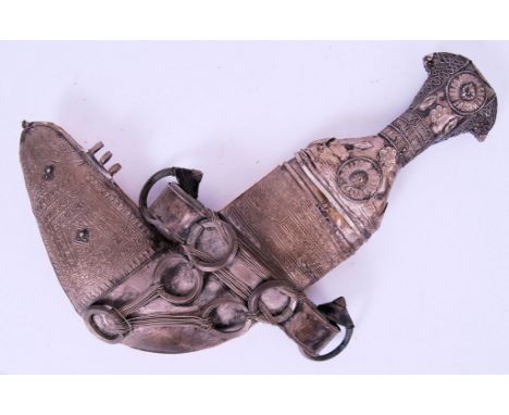 A 19th century Yemeni Jambiya dagger / knife. With unusual right angled blade. Heavily and neatly decorated matching scabbard