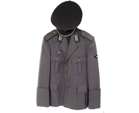 A post WWII German c1956 Air Force uniform jacket (with badge) and original peaked cap with silvered thread decoration.  POST