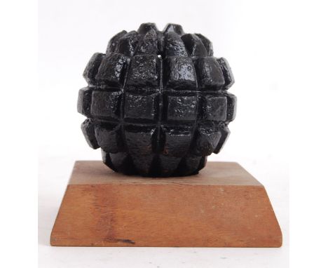 An original WWII Second World War German infantry grenade topper (circular ribbed form). Comes with a wooden display plinth. 