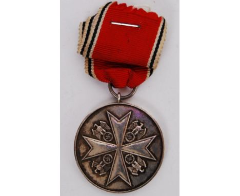 An original WWII Second World War Third Reich Nazi ' Faithful Service ' medal. With original ribbon. Notation to one side for