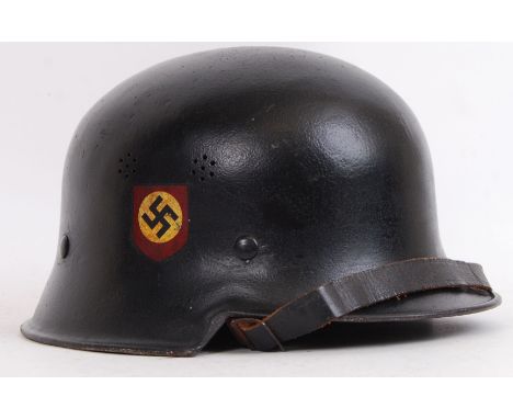 An original WWII Second World War Third Reich Nazi uniform infantry police helmet. With swastika decal to one side and other 