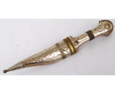 An early 20th century Syrian made Jambiya dagger / knife. With a likely silver white metal handle, with scabbard. 28cm long. 