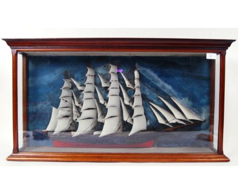 An antique likely 19th century half block model of a tall ship. In a fully glazed mahogany display cabinet. The model being h