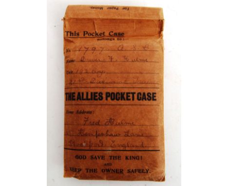An original wartime 'The Allies Pocket Case' folding paper case containing a bible and 'Soldiers Armour,' book. The front of 