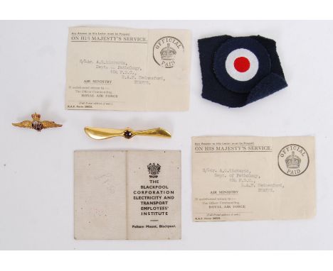 A collection of assorted RAF and related memorabilia to include a membership card, a gold plated propeller brroch, RAF brooch