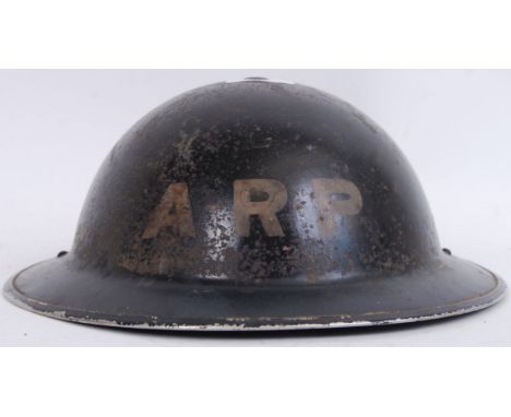 An original WWII Second World War period ARP uniform helmet. Black, with original inner liner. POSTAGE: Worldwide postage / d