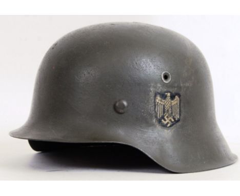 An original WWII Second World War German Infantry uniform helmet. AF - with 'battle damage' split to top (see photo). Possibl