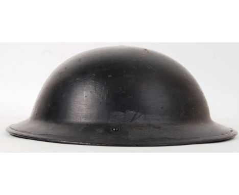 An original vintage WWII Second World War c1939 Civil Defense uniform helmet. With liner and strap.  POSTAGE: Worldwide posta