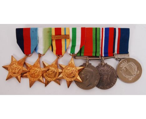 An original WWII Second World War and post war medal group on bar. Comprising of; 39-45 Star, Atlantic Star, Africa Star, Ita