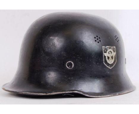 An original WWII Second World War era Third Reich / Nazi police helmet. With emblems to both sides of the helmet and original