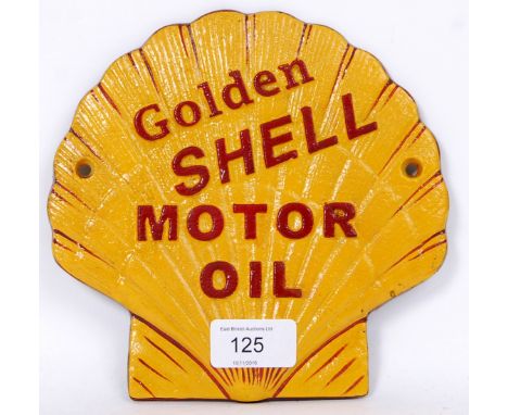 A vintage style 20th century cast iron hand painted wall plaque with notation for Shell Oil. In the form of a shell.  POSTAGE