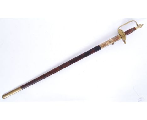 An original antique US NCO officers dress sword. Decorative brass hilt with wooden grips. In original leather and brass scabb