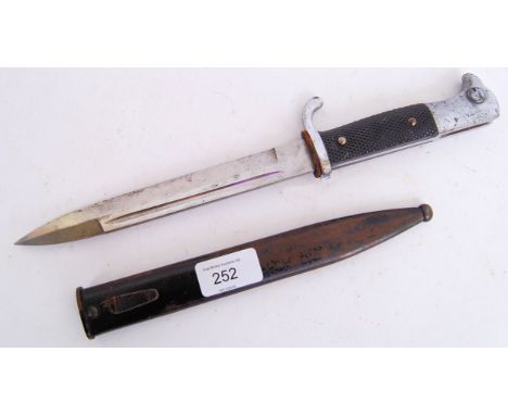 An original WWII Second World War German rifle bayonet. Complete with original scabbard. Approx 35cm long.  POSTAGE: Worldwid