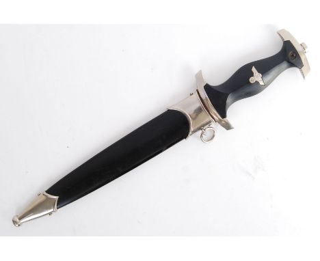 A Second World War WWII style Third Reich Nazi SS dress dagger. With blackened handle and inset white metal eagle / swastika 