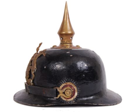 An original antique WWI German Pickelhaube helmet. Complete with brass emblem to front, and brass chin strap holders to sides