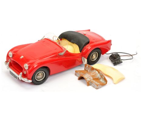 Victory Industries Triumph TR2 Sports Car, red with cream seats, battery operated plastic model (untested), circa 1950's, pla