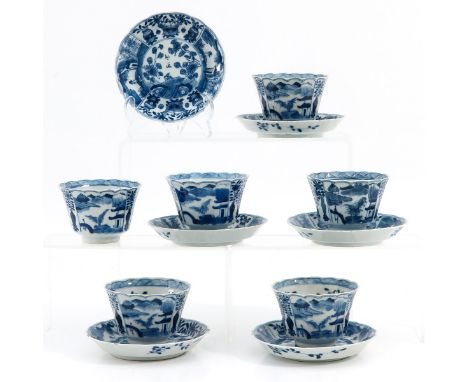 Garden decor with Chinese antiquities, saucers are 12 cm. in diameter, Kangxi mark, chip and hairline.