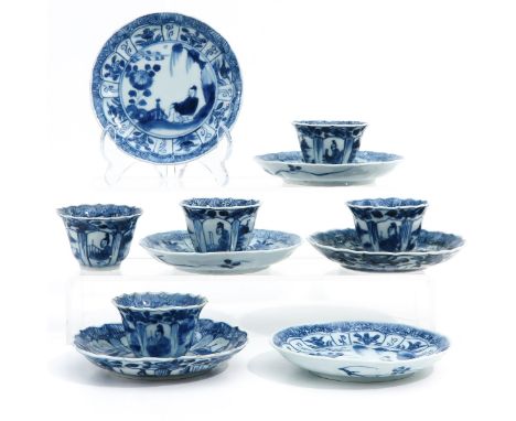 Blue and white decor, including 5 cups and 6 saucers, chip.