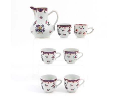 Including pitcher and 6 cups in floral decor, pitcher is 15 cm. tall. 