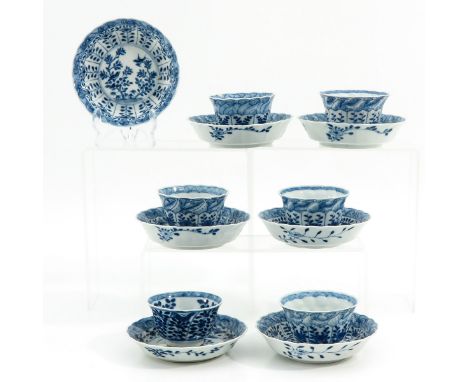 Blue and white decor depicting flowers and birds and garden, saucers are 13 cm. in diameter, chip and hairline.