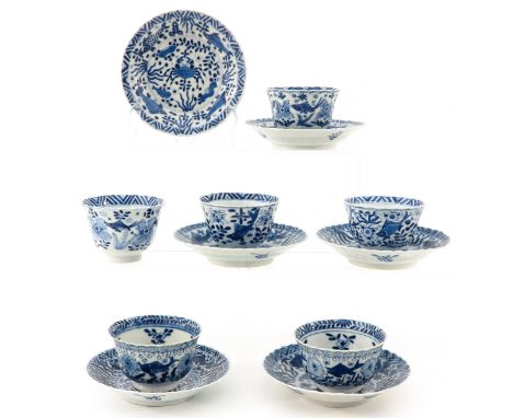 Decorated with fish and sea creatures, Kangxi mark, saucers are 13 cm. in diameter.
