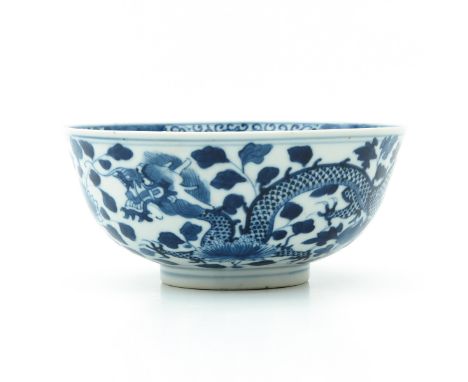 Decorated with dragons and flowers, Kangxi mark, 18th - 19th Century, 19 cm. in diameter. 