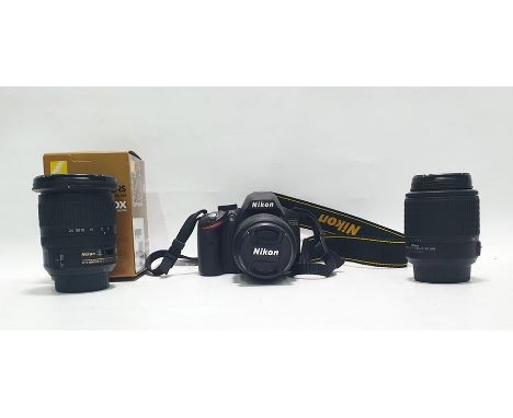 Nikon D3200 camera and two lensesCondition ReportThe camera powers up and has no obvious damage or marks. The lot contains 3 
