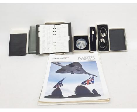 Collection of Concorde related memorabilia to include Corcorde Special News magazines, paperweights, ink blotter, two wallets