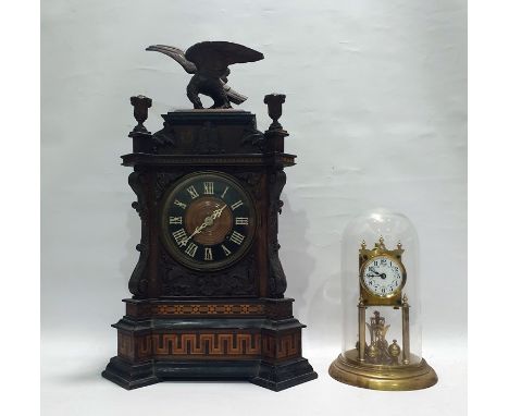 Mid to late 19th century mantel cuckoo clock in ornate Black Forest style case, featuring geometric patterns, foliate carving