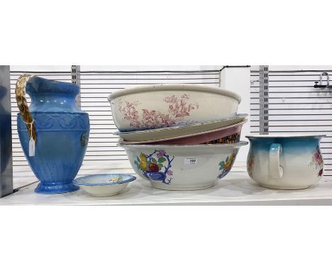 Four assorted ceramic wash basins, a chamber pot, a small dish and a blue and gilt glazed ewer by J &amp; G Meakin
