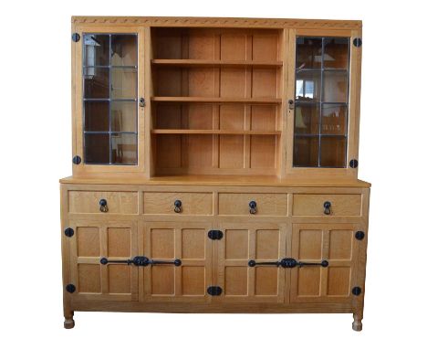 Workshop of Robert Thompson of Kilburn, Mouseman oak display dresser, central bookcase with three adjustable oak shelves flan