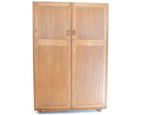 Ercol elm two door double wardrobe, 122cm (48in) wide, 55cm (21.5in) deep, 183cm (72in) high.