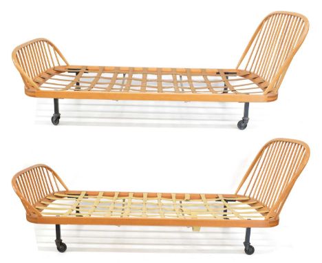 Two Ercol beech and elm single beds (Ercol bed), 218cm (86in) wide, 97 deep (38in), 86cm (34in) high.