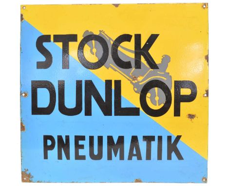 An early 20th Century German Dunlop blue and yellow enamel sign for 'Stock Dunlop Pneumatik' with a car and driver travelling