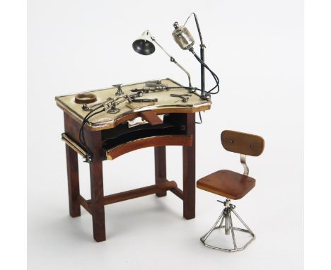 A novelty miniature wood and silver model of a jewellers work table and chair, stamped marks, with angle-poise lamp, pliers, 