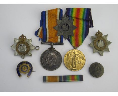 A World War I Pair to 24637. Pte. J Felton. Devon R., War and Victory Medals together with cap badges, button and good luck l
