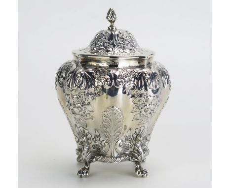 A Late Victorian silver tea caddy, maker's mark worn, Chester 1896, of lobed oval form, with hinged domed lid, having shell a