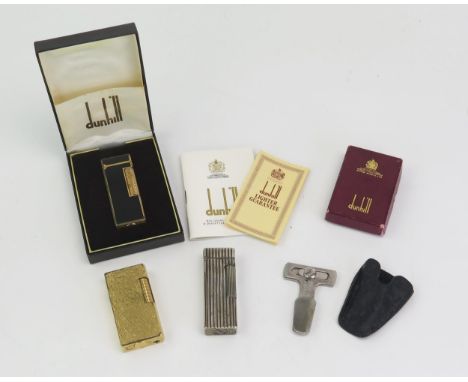 A Dunhill gilt metal and black lacquer Rollagas lighter, cased with instructions and guarantee, a Dunhill pipe reamer, boxed,